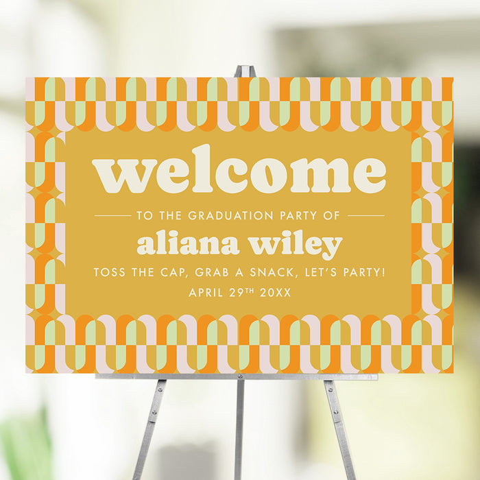 Retro graduation party welcome sign with a colorful geometric pattern
