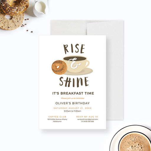 Rise and Shine breakfast birthday invitation with a coffee cup and bagel illustration on white.