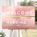 Elegant blush pink wedding welcome sign with gold accents for ceremony or reception entrance