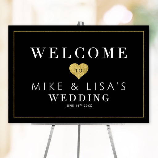 Romantic wedding welcome sign featuring elegant gold heart design on black background