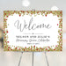 40th wedding anniversary welcome sign with red ruby accents, gold faux glitter border, and elegant lettering displayed on an easel.