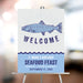 Seafood feast welcome sign featuring a vintage fish illustration for a fish fry or coastal birthday party celebration.