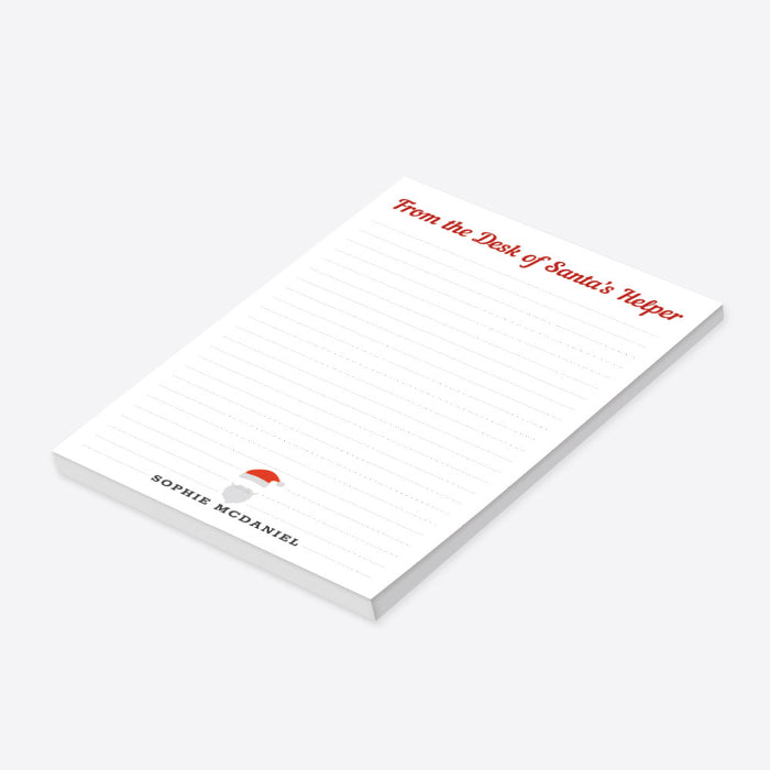 Christmas notepad with "From the Desk of Santa's Helper" and a Santa hat illustration, making it a perfect custom stationery gift this holiday season.-side