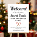 Secret Santa welcome sign featuring a Santa hat and candy cane design, perfect for holiday party décor during gift exchange celebrations.