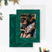 Sending joy holiday photo card featuring green leaf border and family photo