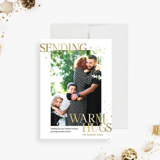 Digital holiday greeting card featuring a family photo with gold Warm Hugs text, perfect for modern Christmas messages and seasonal greetings.