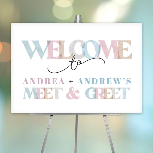 Pastel sip and see welcome sign for twins featuring the phrase “Welcome to the Meet & Greet” in soft pink, blue, and beige lettering.