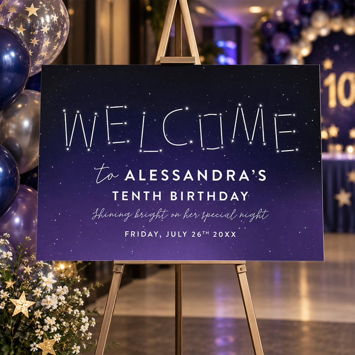 Starry night birthday welcome sign with constellation lettering on a navy-purple gradient background displayed on an easel