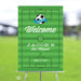 Personalized soccer-themed Bar Mitzvah welcome sign with a green field design, displayed on an easel for a sports-themed Jewish party