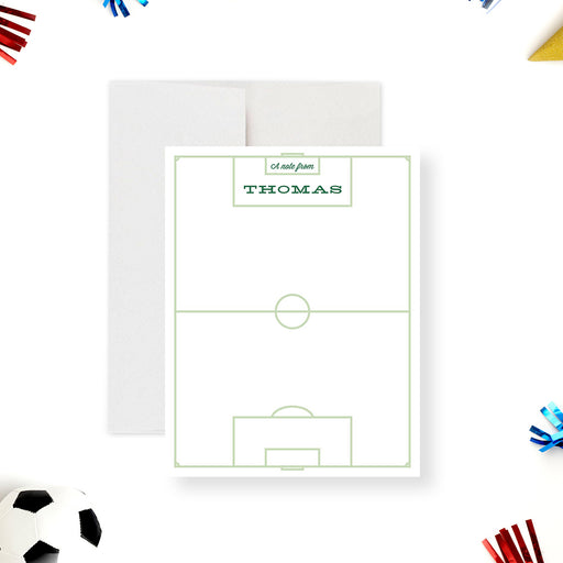 Personalized soccer thank you cards with a field outline on the white writing front and a soccer ball on the green striped reverse.