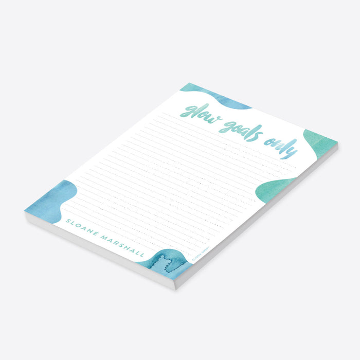 Personalized spa party notepad featuring a soft blue and green watercolor design with “glow goals only” lettering and custom name-side