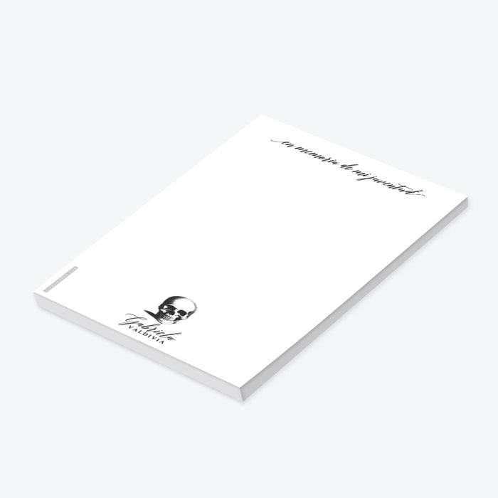 Spanish gothic skull notepad with the phrase “En memoria de mi juventud” for a Death to My 20s themed birthday party.-side