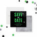 Halloween save the date card featuring green dripping text, a spider web design, and a spider graphic on a black background.-front-back