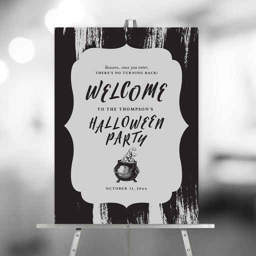 Black Halloween welcome sign featuring an elegant spooky design with witch cauldron illustration for a stylish party entrance display