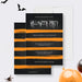 Halloween party invitation template with black background, orange brush strokes, and spooky text