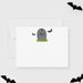 Halloween-themed stationery set with a gray tombstone and bats on a white background