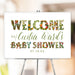 Personalized floral baby shower welcome sign with custom name and date, decorated with vibrant flower-filled letters.
