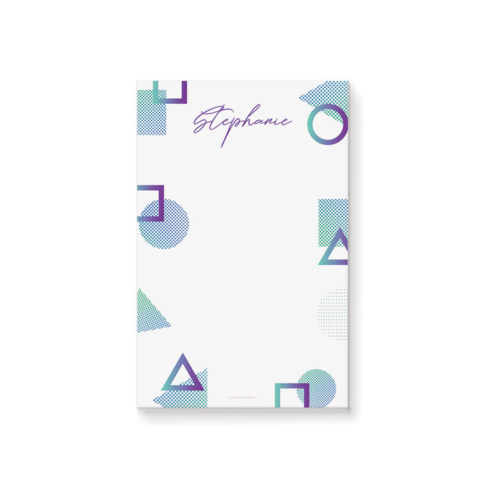 Personalized notepad with purple and teal geometric shapes and custom name in elegant script.