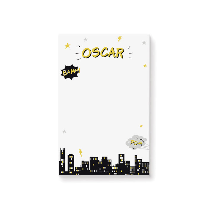 Personalized superhero notepad featuring a comic-style graphics, city skyline, and playful accents with customizable name