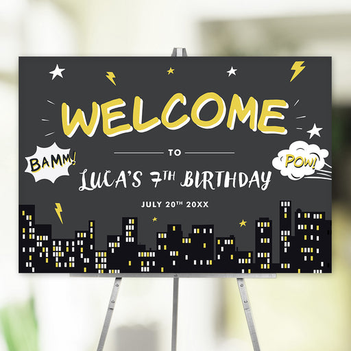 Superhero-themed welcome sign with comic graphics, city skyline, and bold lettering for a child’s birthday party entrance