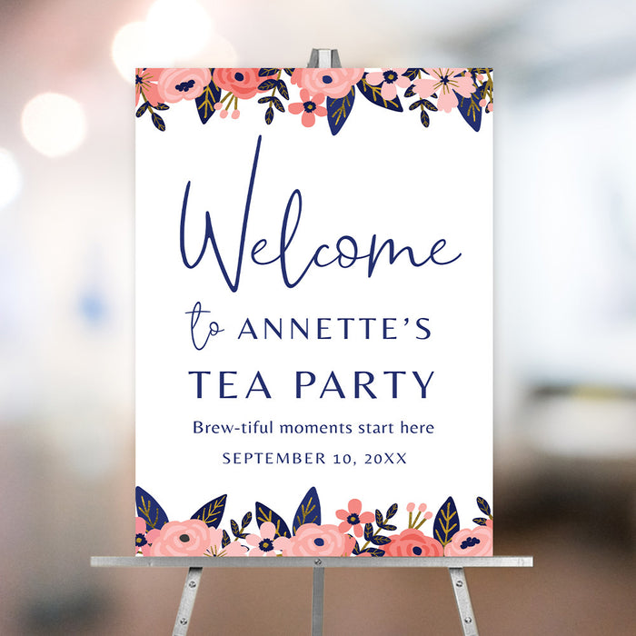 Floral tea party welcome sign with pink flowers and elegant lettering displayed on an easel for a birthday afternoon tea celebration.