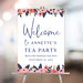 Floral tea party welcome sign with pink flowers and elegant lettering displayed on an easel for a birthday afternoon tea celebration.
