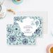 tea party bridal shower invitation with white teapot illustration, floral mint background, tea tag, and personalized bridal shower details-front-back