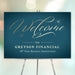teal and gold-style corporate anniversary welcome sign with elegant script lettering for a formal business dinner event