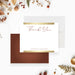 personalized wedding thank you card with elegant thank you lettering, custom couple names, white background, and warm terracotta details-front-back