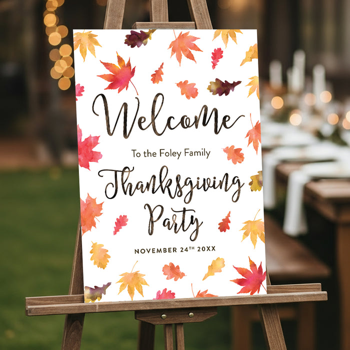 thanksgiving welcome sign with autumn leaves displayed on easel for fall party entrance