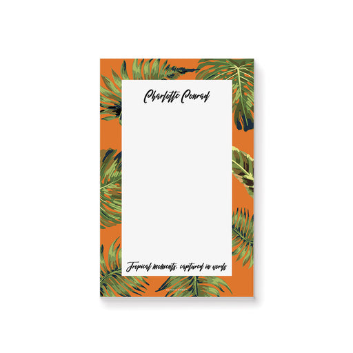 Personalized notepad with an orange background and green leaves, perfect as custom bachelorette party favors or tropical-themed gifts.