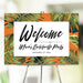 Tropical welcome sign featuring a palm leaf design, customized for bachelorette parties or photo booth decoration.