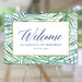 Tropical birthday welcome sign featuring watercolor palm leaves, personalized for party entrance decor or a photo backdrop.
