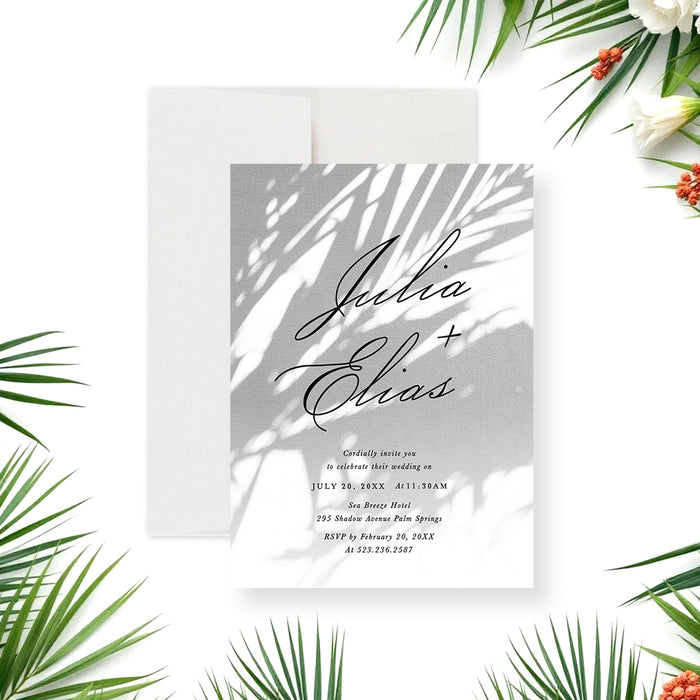 tropical palm wedding invitation with soft palm shadow design and elegant script lettering for a garden wedding-front