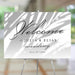 tropical wedding welcome sign with soft palm shadow design and elegant script lettering for a beach or garden wedding