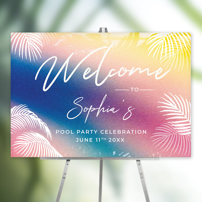 tropical pool party welcome sign with a blue, pink, and yellow gradient background and white palm leaves