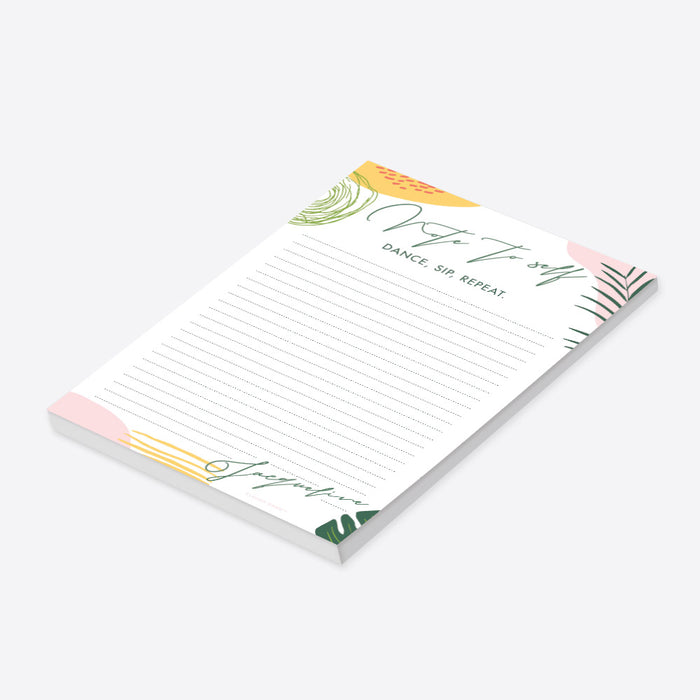 Personalized tropical bachelorette notepad featuring botanical leaves and foliage in soft pastel colors-side