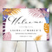 Botanical wedding welcome sign featuring colorful tropical palm and monstera leaves