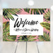 Wedding welcome sign featuring a tropical palm leaf design for a tropical theme party decoration and entrance poster.