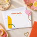 Vibrant personalized note card with geometric shapes in orange, pink, yellow, and green-front