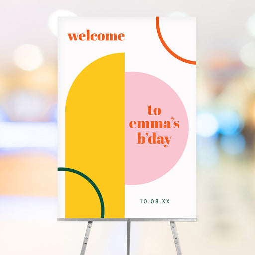 Modern geometric birthday welcome sign featuring bold pink, yellow, green, and orange shapes, customizable for party entrances, decor, and photo backdrops.