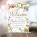 Vintage botanical wedding welcome sign featuring elegant floral garden illustrations with soft neutral tones, perfect for a romantic wedding entrance display.
