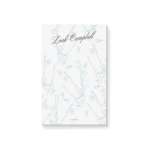 Personalized botanical notepad featuring an elegant floral design with name