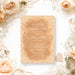 Vintage peach wedding invitation with white lace borders, elegant script names, and personalized wedding details.