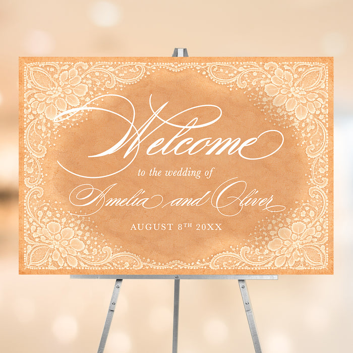 Vintage peach wedding welcome sign with white floral lace borders, elegant script lettering, and personalized couple names.