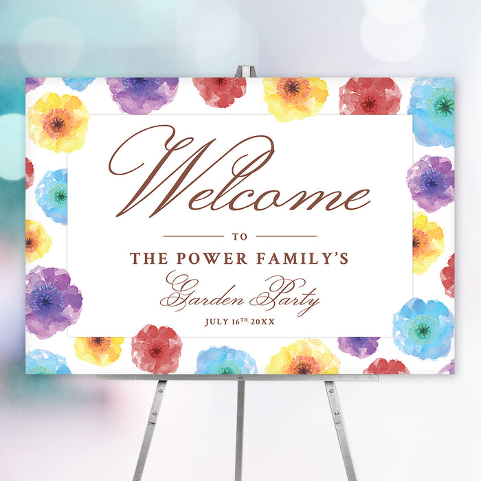 colorful watercolor floral garden party welcome sign with elegant lettering, personalized family text, and easel display
