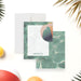 Personalized pool party note cards with a beach ball beside the white writing panel and a green watercolor pool pattern on the reverse.