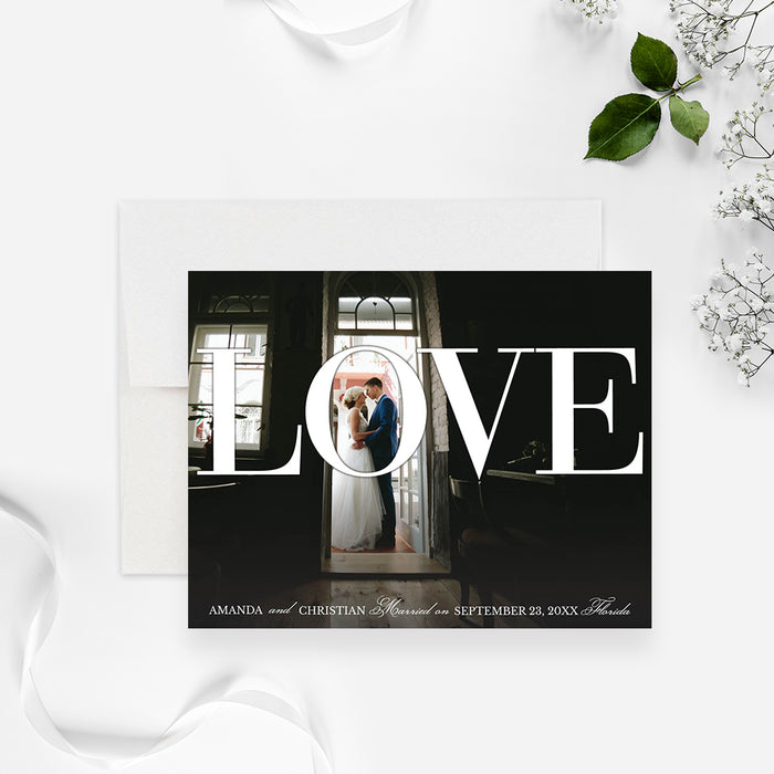 wedding announcement photo card with custom couple photo, large Love lettering, and personalized marriage details-front