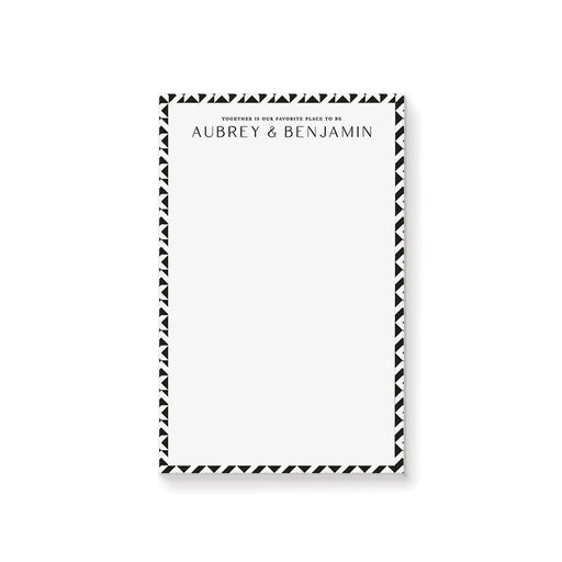 Black and white geometric personalized wedding notepad with custom couple names printed at the top