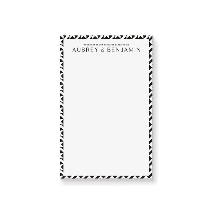 Black and white geometric personalized wedding notepad with custom couple names printed at the top
